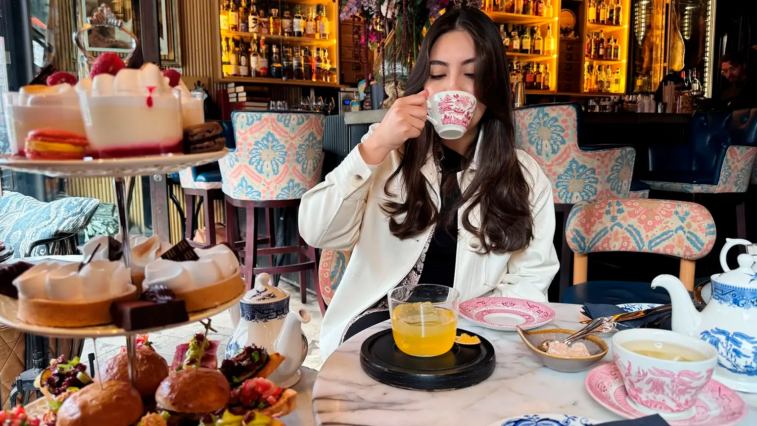 Girl drinking some cocktails in a shop